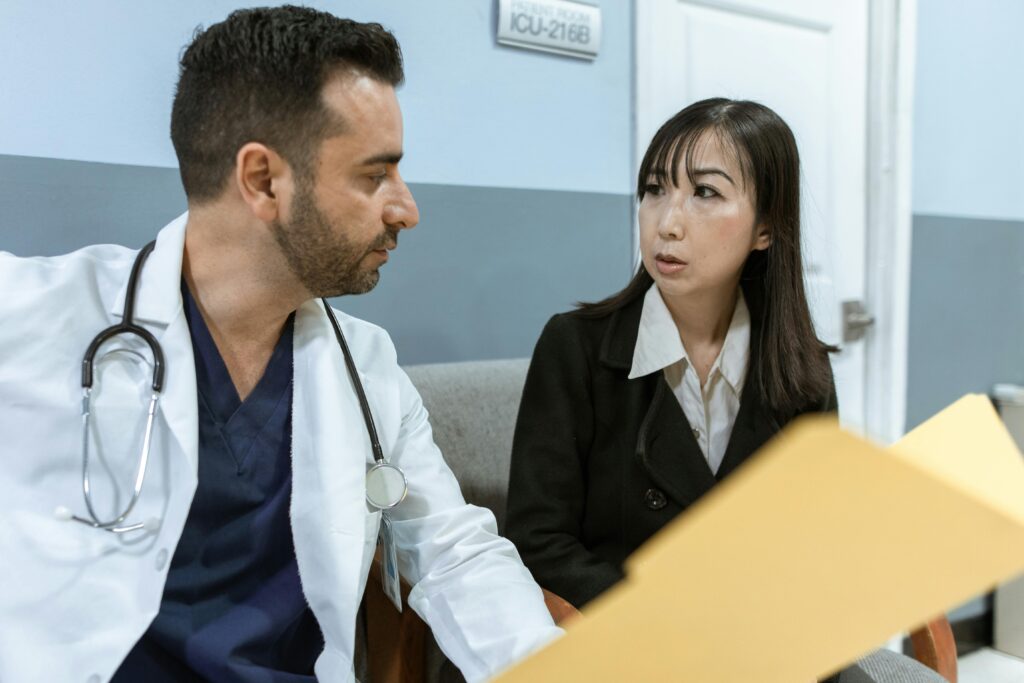confused doctor looking at a patient