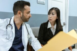 confused doctor looking at a patient