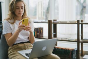 A woman looking at her phone